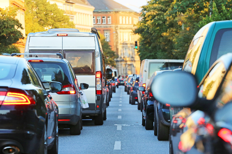 A double traffic jam of cars on a city boulevard